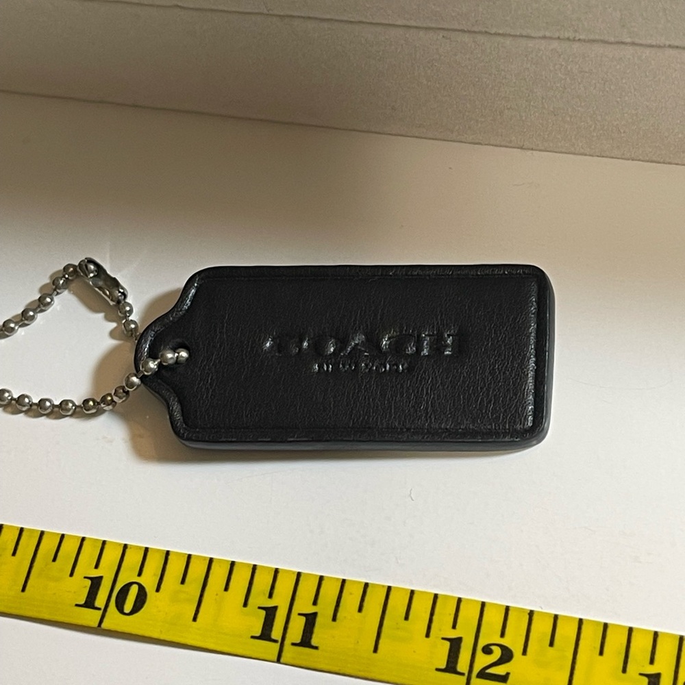 BLACK LEATHER COACH TAG